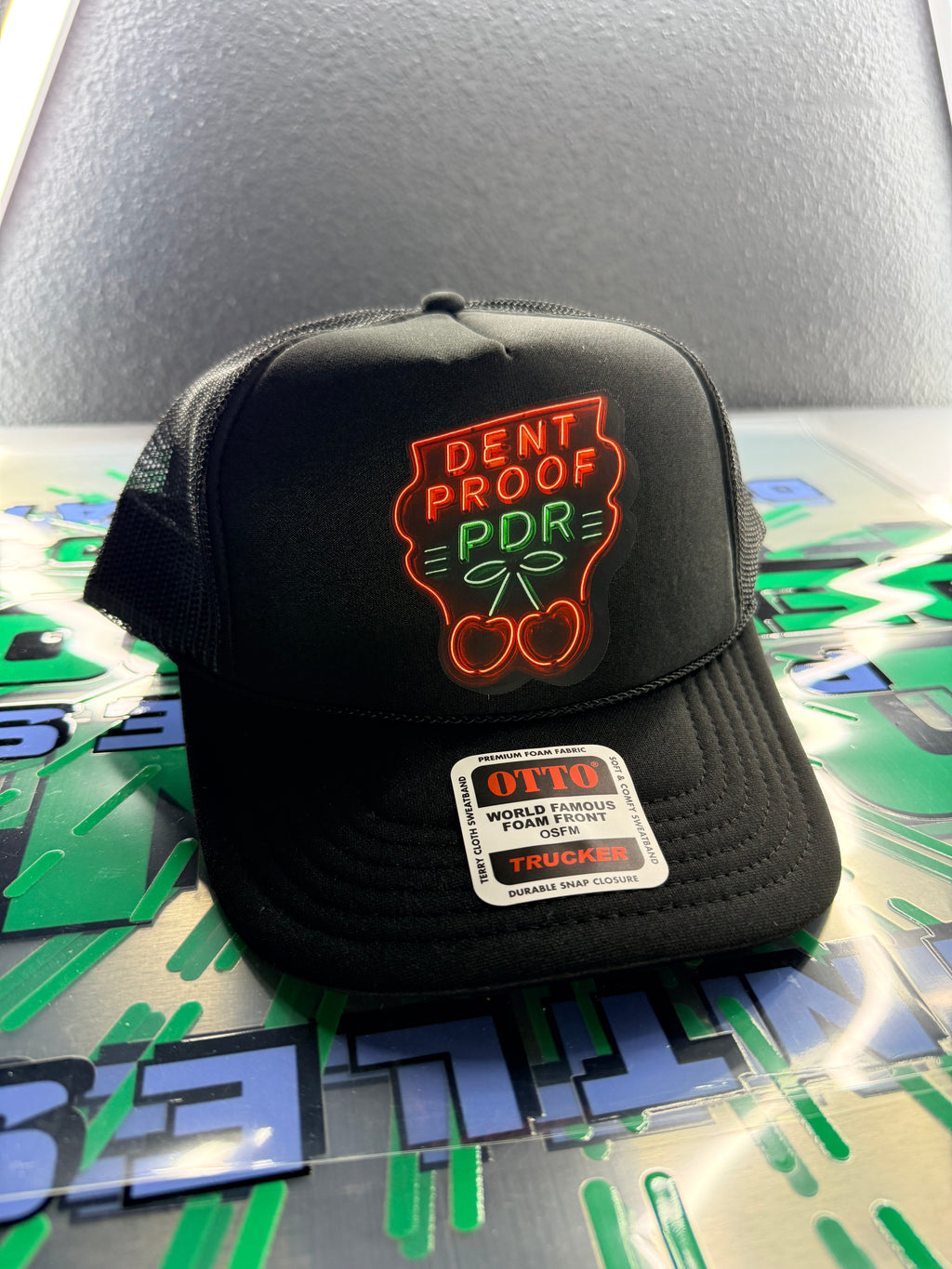 Dentproof neon cherries hat.