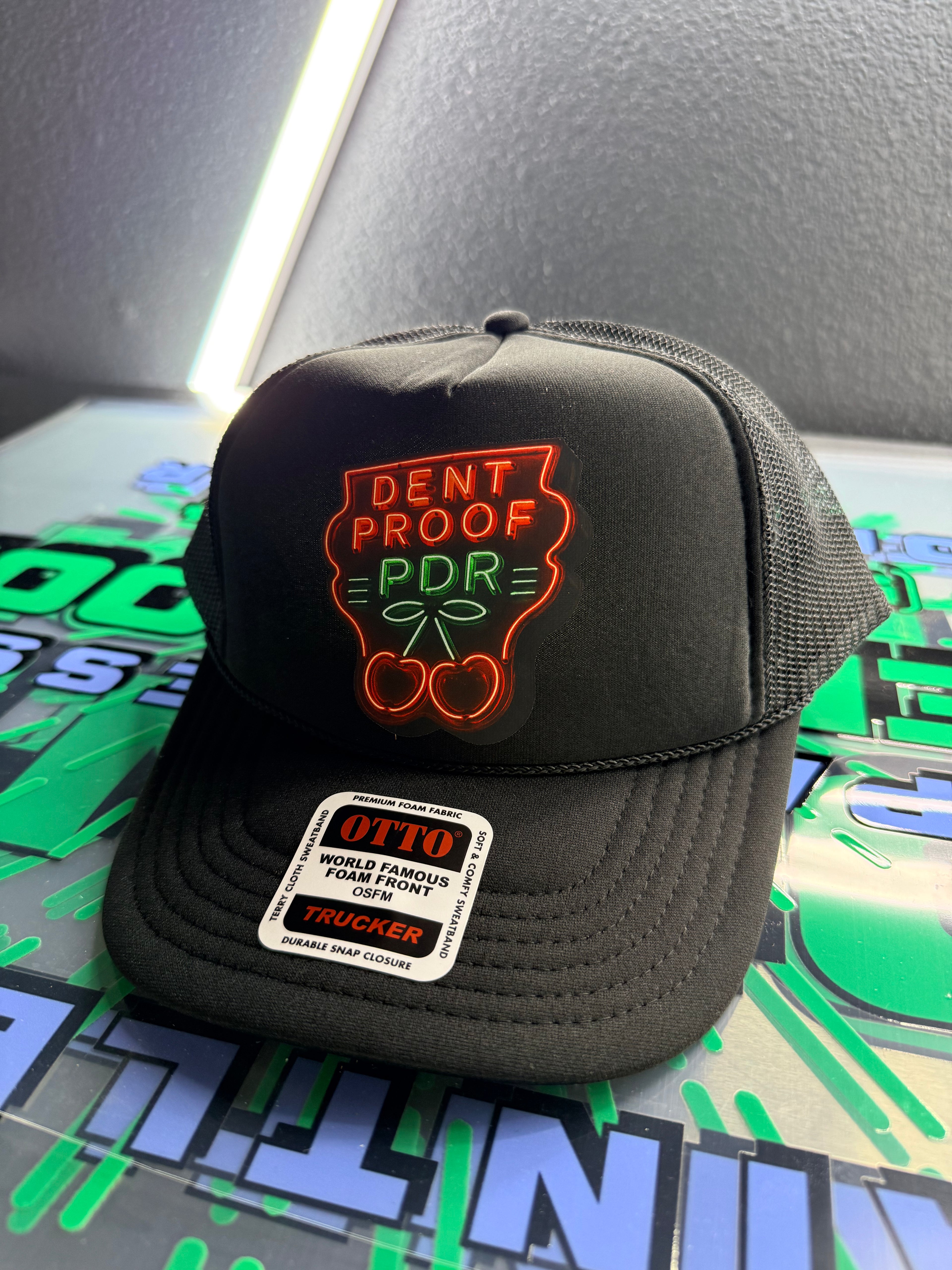 Dentproof neon cherries hat.